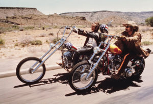 2 bikers in Easy Rider movie riding across desert road