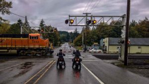 2 motorcyclists at railroad crossing
